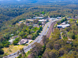 Drone aerial photograph of residential buildings and lush suburban foliage located in the town of Springwood in the Blue Mountains in New South Wales, Australia.