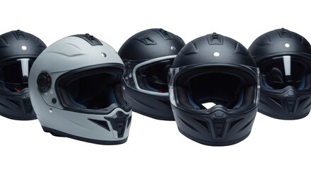 Fototapeta premium Five motorcycle helmets in different shades of black and gray on black
