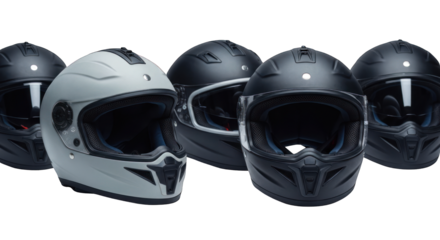 Five motorcycle helmets in different shades of black and gray on black