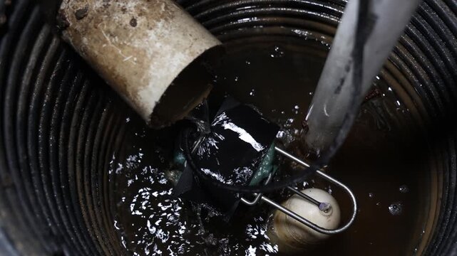 French drain system draining water into well to prevent flooding on home basement 