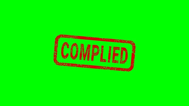 Appearance of a dirty red stamp mark "COMPLIED" surrounded by a rounded frame from above on a green screen with alpha channel