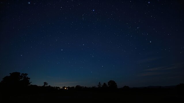 Starry night sky over landscape with silhouettes of trees and horizon. - Powered by Adobe