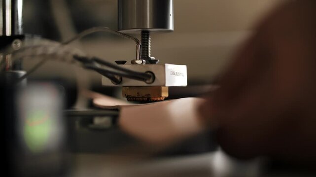 Leather embossing machine in workshop