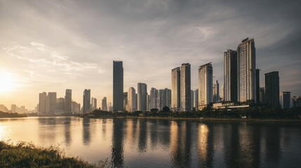 Fototapeta premium modern city skyline at sunset, skyscrapers reflecting golden light, calm river in foreground, urban atmosphere, cinematic perspective