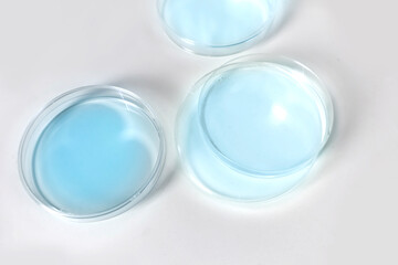 Clear bottles and dishes are used in scientific and medical experiments.