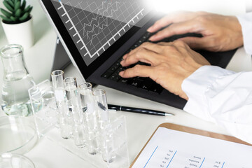 Researchers study data and conduct chemical experiments, in the creation of drugs, scientific data collection experiments