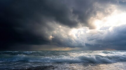 Landscape photograph of a stormy sky over the ocean. the sky is filled with dark, ominous clouds that are covering most of the sky.