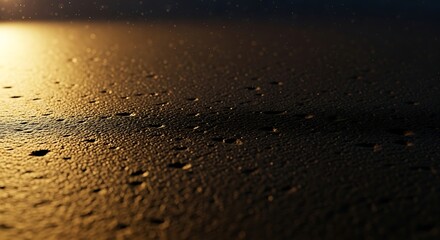 Golden Light Reflecting on Wet Sand Surface Abstract Macro Shot