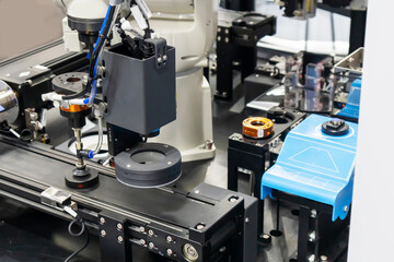 Robotic arms in large industrial production systems and robotic management systems