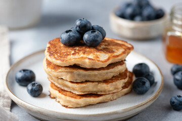 Stack of gluten free vegan oat pancakes with blueberries