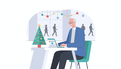 Senior professional working on laptop in a modern office decorated for the Christmas holidays