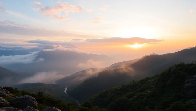 Golden sunrise over misty mountain valley, serene landscape beauty
