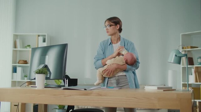 Work-Life Balance Family Care Hybrid Parenting. A Professional Woman Stands in Her Modern Office Feeding Her Baby With a Bottle, Parenthood