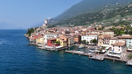 Fototapeta premium Harbour Malcesine Lake Garda Italy high angle drone,aerial blue sky