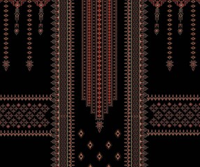 Detailed red embroidery pattern on black fabric showcasing an intricate textile design with ethnic and geometric elements