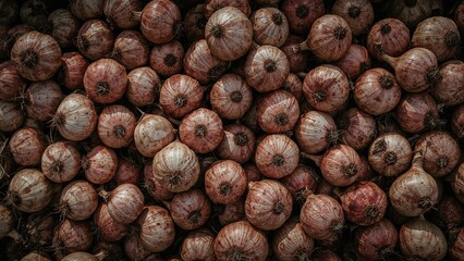 A large collection of onions piled together.