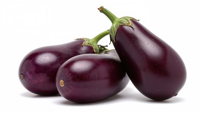 Three eggplants with a deep purple color and glossy surface, arranged together on a white background.