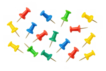 Colorful assorted push pins scattered, a mix of red, blue, green, and yellow tacks with metal points