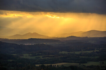 Lusatian mountains in dark autumn with sunrays
