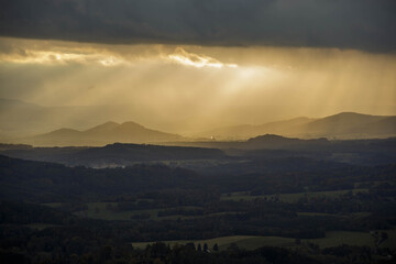 Lusatian mountains in dark autumn with sunrays
