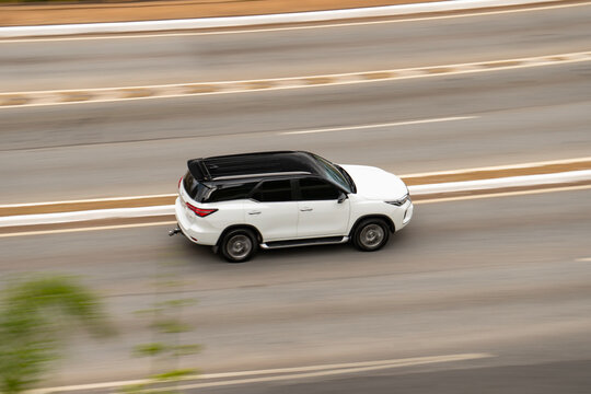 White Toyota SW4 driving on highway, Large SUV, two-tone, panning shot