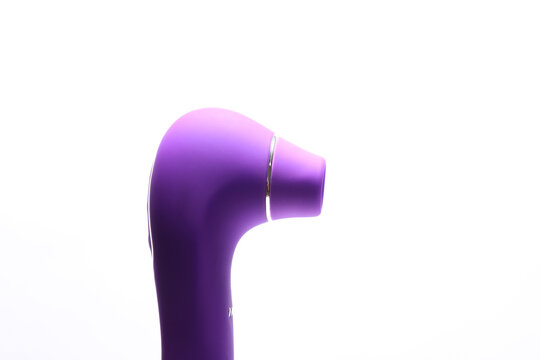 Sex toy. Purple vacuum vibrator on white background