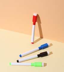 Colored markers on a beige background. Creative layout