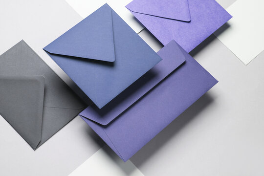 Floating envelopes and cards on gray background with shadow. Minimalism, modern business still life, creative layout - Powered by Adobe