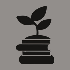 A black silhouette of a seedling growing from a stack of books on a grey background symbolizing knowledge growth