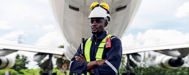 Aircraft workers checking airplane. Ground personnel at the airport check the hydraulic system of the landing gear of the aircraft
