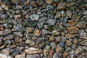 The stone wall texture background natural color. Background of stone wall texture photo. Natural stone wall texture for background. Old Brick texture, Grunge brick wall background.