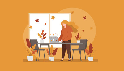 Remote work setup Woman using laptop in an autumnal interior setting Fall concept