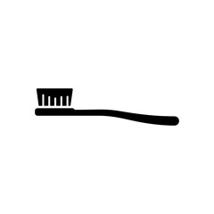 Black toothbrush rests on white surface, ready for use in a clean and minimalist bathroom setting, promoting oral hygiene and a fresh start.