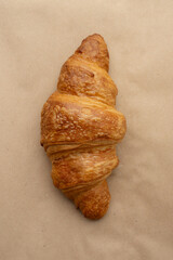 croissants in a paper bag on a white isolated background