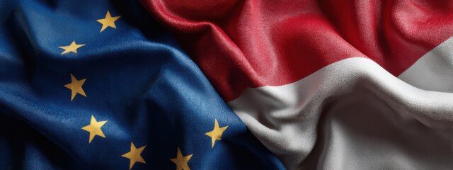 Flags of the European Union and Indonesia displayed together on a textured surface