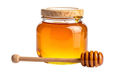 A clear glass jar of golden honey, a wooden dipper lies beside it, all on black