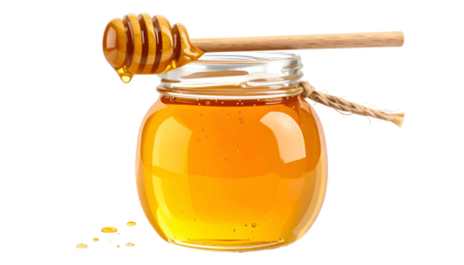 A jar filled with golden liquid, with a wooden dipper resting on the lid