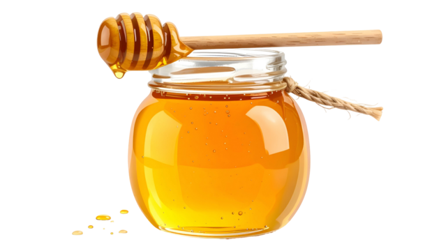A jar filled with golden liquid, with a wooden dipper resting on the lid