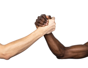 Two arms of different skin tones clasp in a handshake against a stark black background