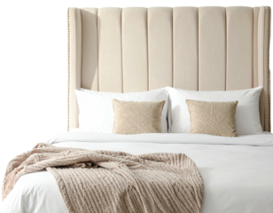 A cozy bed with a tall, upholstered headboard, clean white linens, and decorative pillows