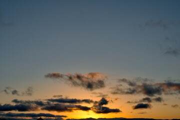 Russia, south of Western Siberia. Panoramic view of the evening sky with the setting sun and colorful clouds.