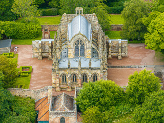 Aerial view of Rosslyn Chapel, it was founded in 1446 by Sir William St Clair. Rural Midlothian. Da Vinci Code movie. Ley lines and rose line. Edinburgh. Scotland. UK
