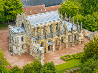Aerial view of Rosslyn Chapel, it was founded in 1446 by Sir William St Clair. Rural Midlothian. Da Vinci Code movie. Ley lines and rose line. Edinburgh. Scotland. UK