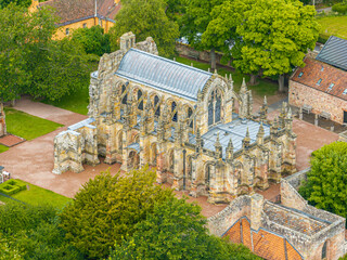 Aerial view of Rosslyn Chapel, it was founded in 1446 by Sir William St Clair. Rural Midlothian. Da Vinci Code movie. Ley lines and rose line. Edinburgh. Scotland. UK