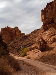 Breathtaking Kazakh canyon with fiery rock layers and dramatic erosion-carved contours.