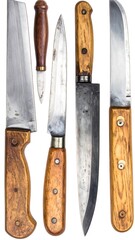 A group of assorted aged kitchen knives with wooden handles, arranged vertically, on white