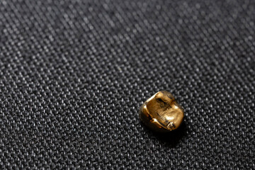 Gleaming Gold Dental Crown on Black Background