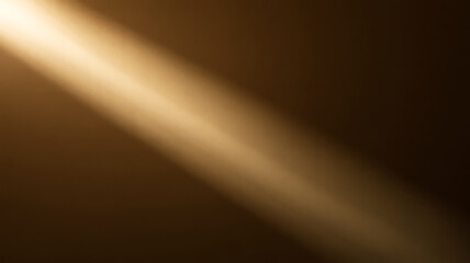 Golden light beam shining diagonally across a dark, textured background