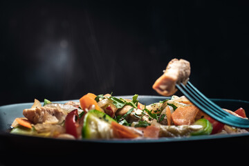 stir-fried dish of chicken, pumpkin, pepper, onion, parsley, garlic, carrot and various vegetables