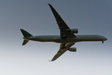 Airplane Preparing to Land Against Blue Sky